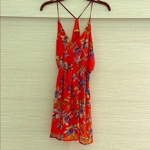 Orange floral print dress.